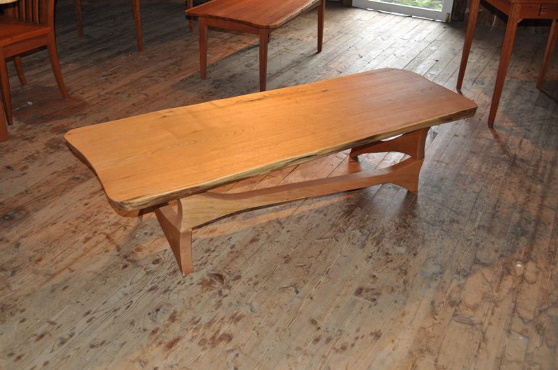BUTTERNUT LIVE EDGE COFFEE TABLE--CHERRY INTERLOCKING BASE
